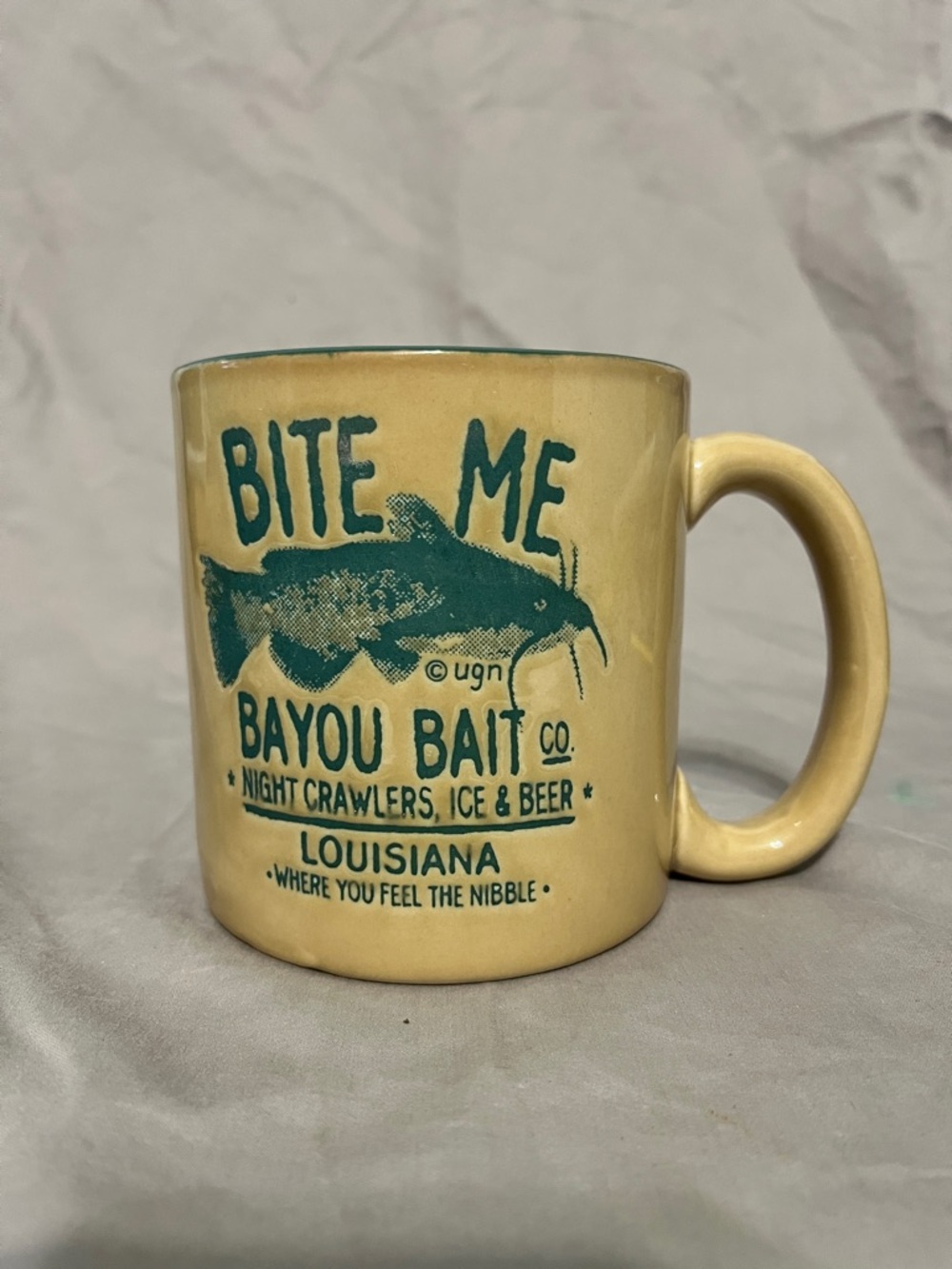 vintage ceramic mug featuring the "Bayou Bait Co." brand and a catfish design